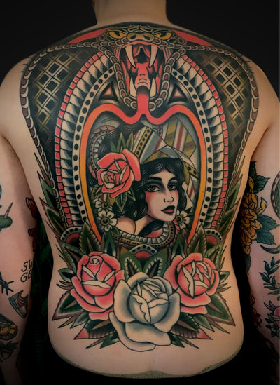 Best American traditional tattoo BACKPIECE in Barcelona with snake, frame and gipsy girl.